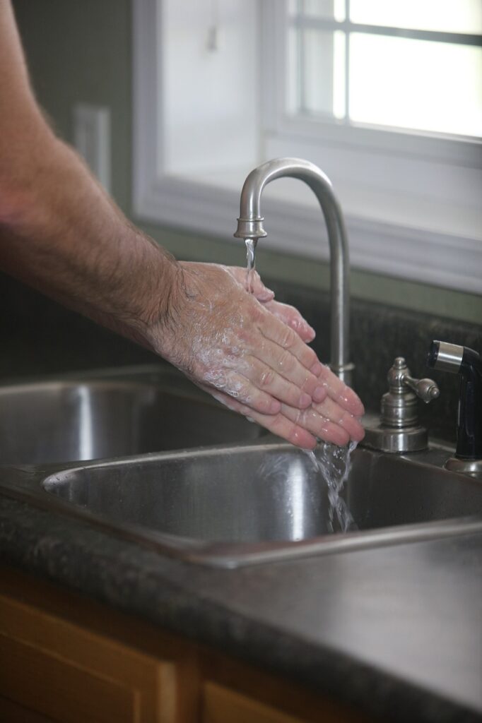 person washing hands - Acute Illness Prevention Tips