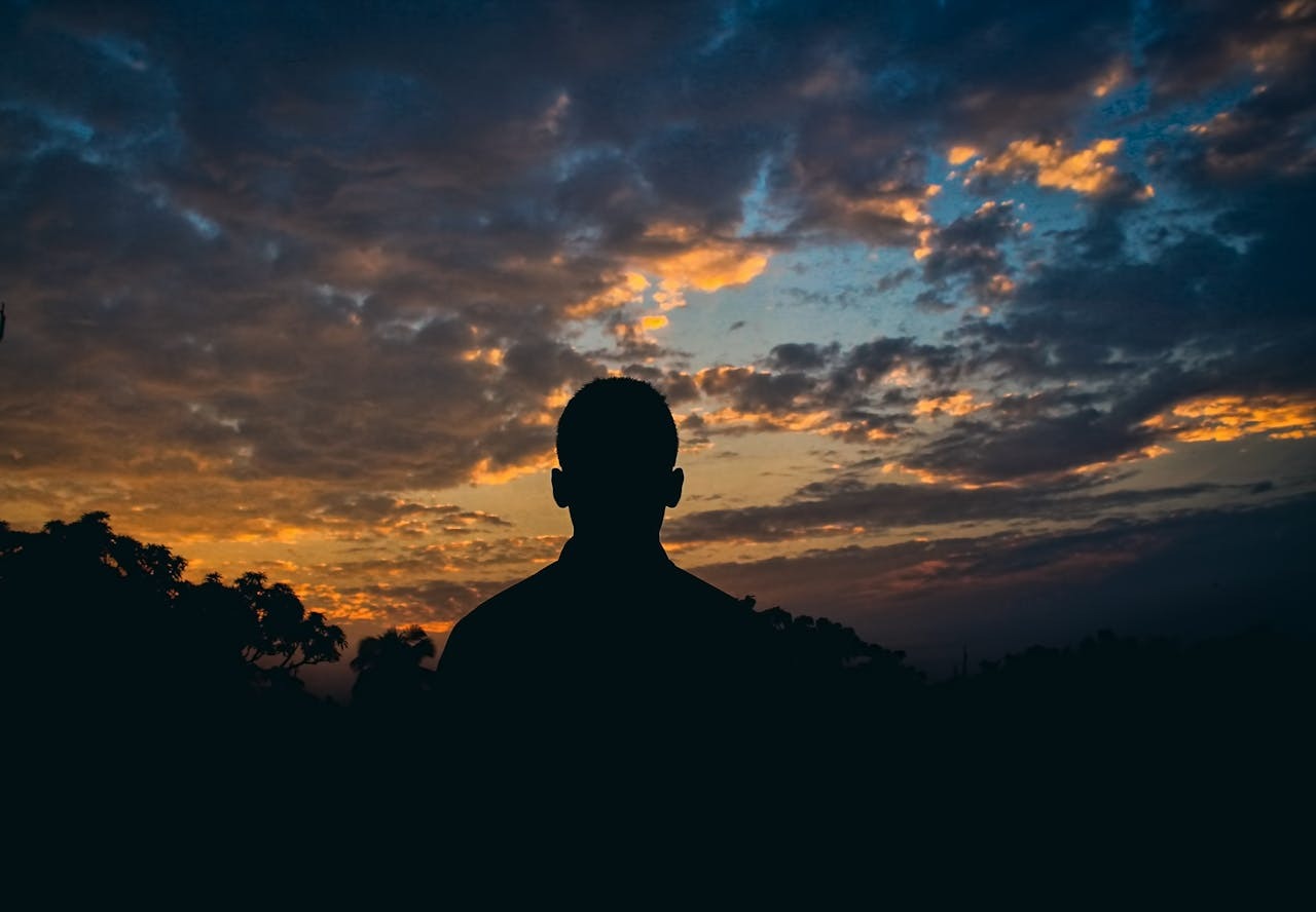 silhouette of man, dusk - STD Wart Treatment Primary Care