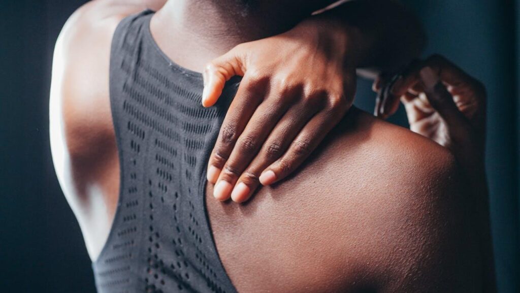 person with back pain, considering Orthobiologics vs Steroid Injections for Back Pain