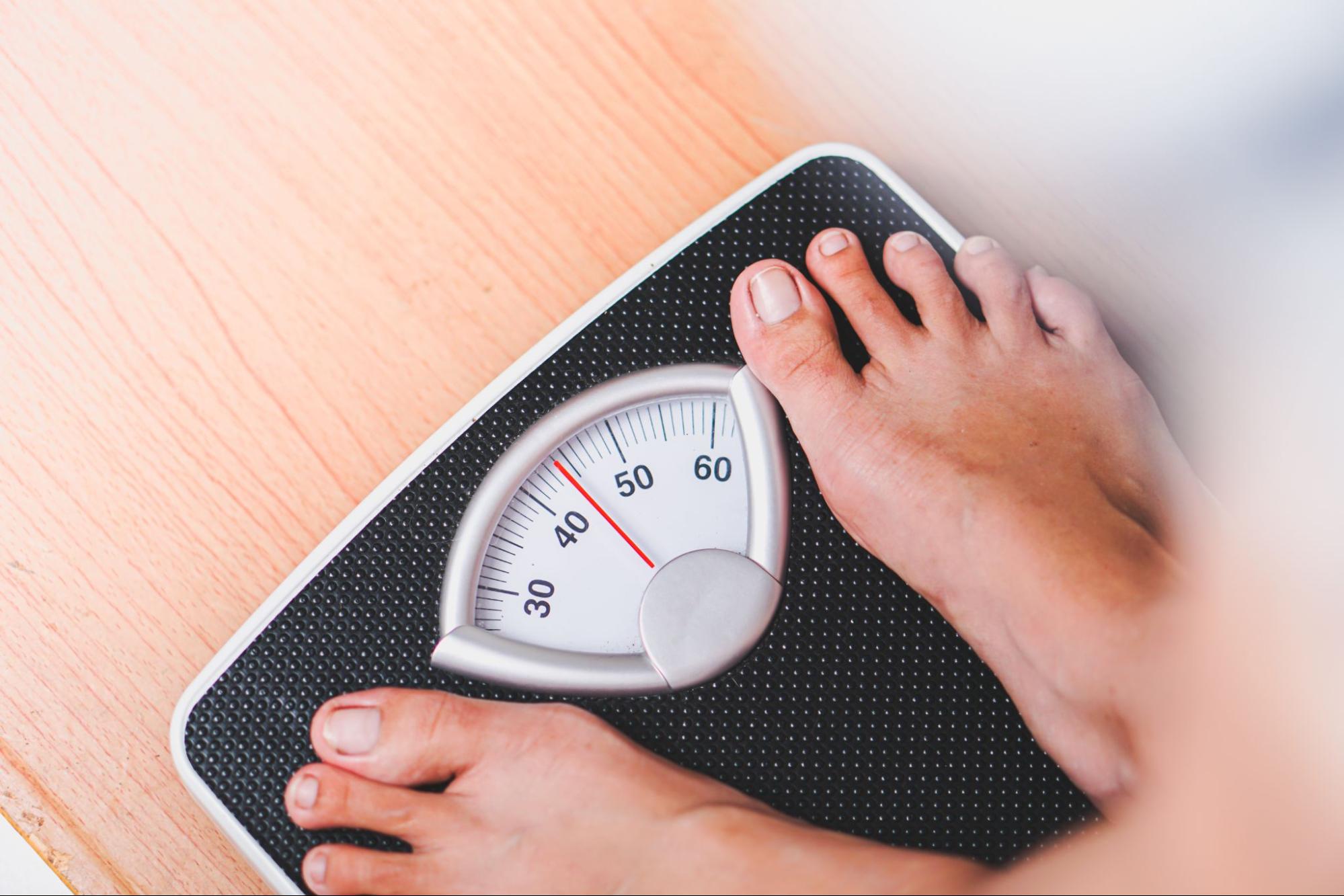 person on a weighing scale
