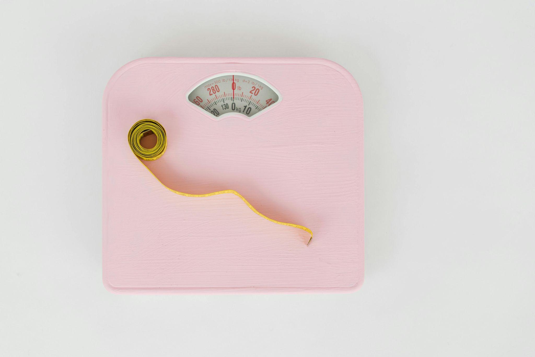 bathroom weighing scale with tape measure on top