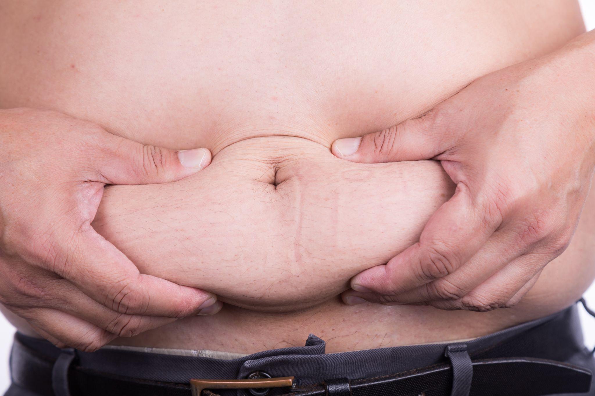 man holding big belly