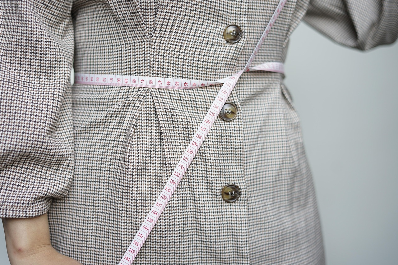 woman with tape measure around waist