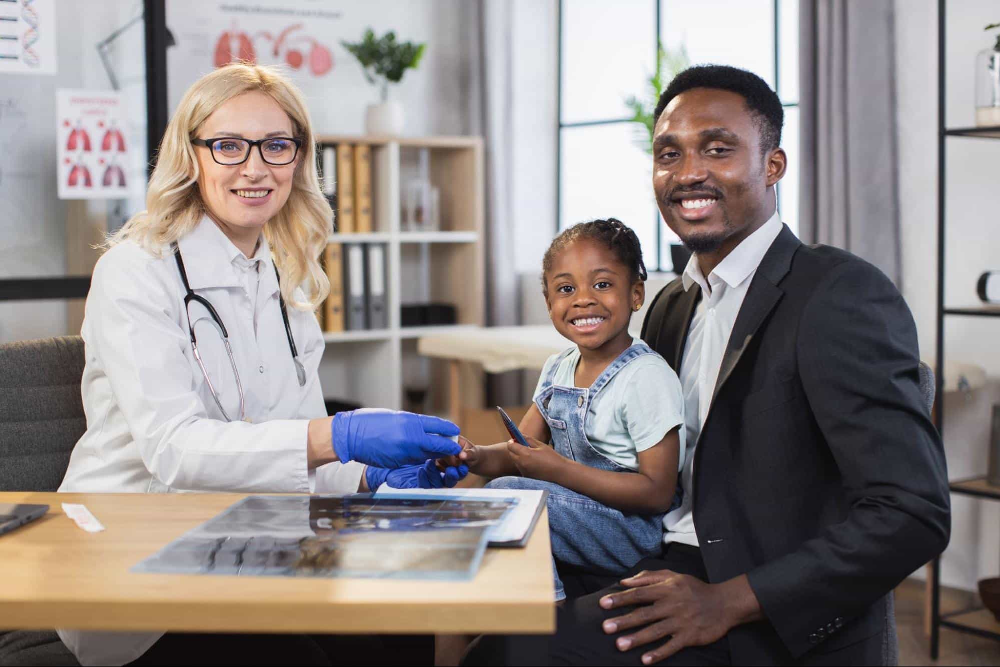 father and daughter in a doctor’s appointment