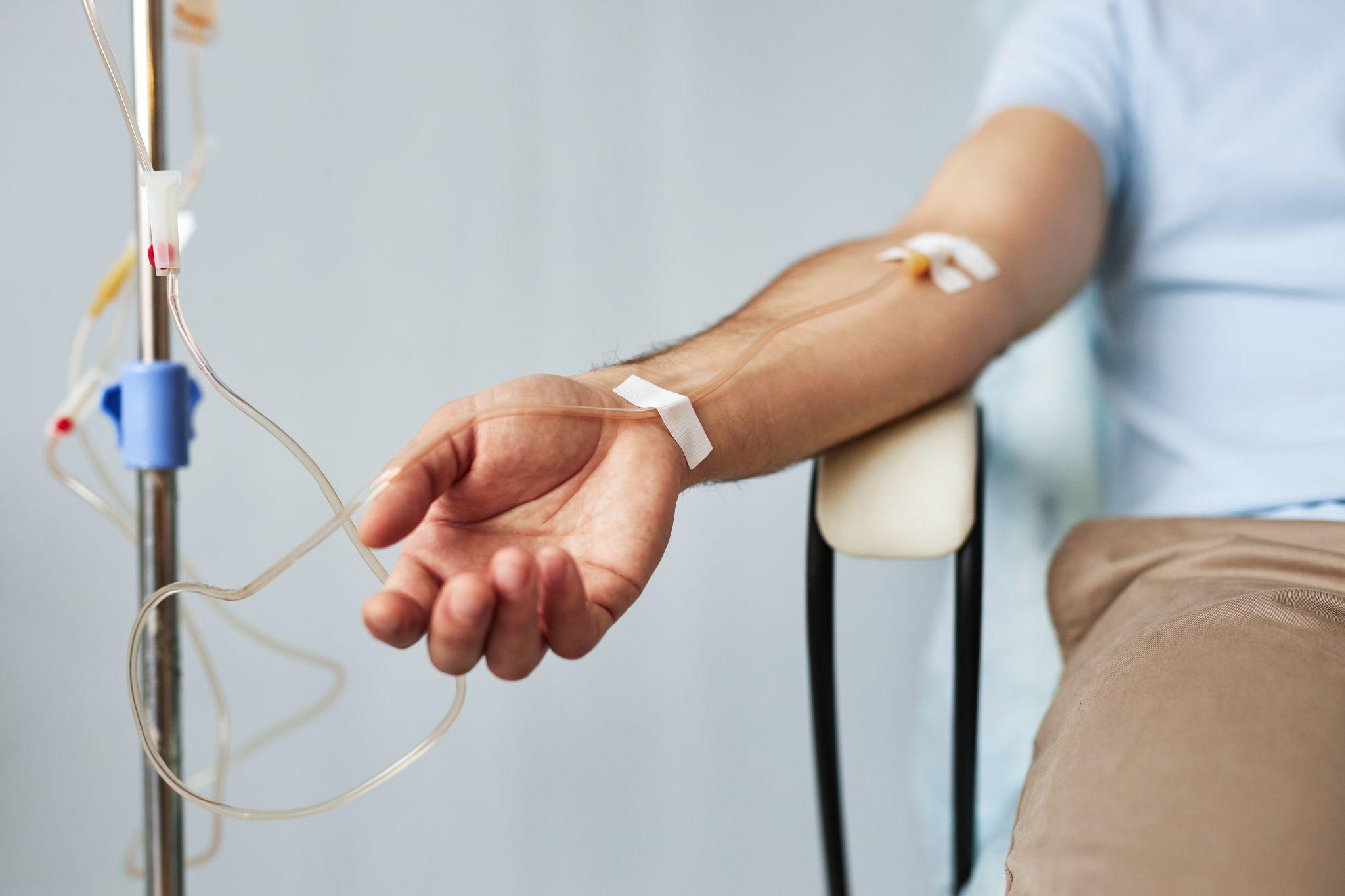 Close-up of patient arm with IV infusion, representing ketamine treatment and what to expect after ketamine therapy.