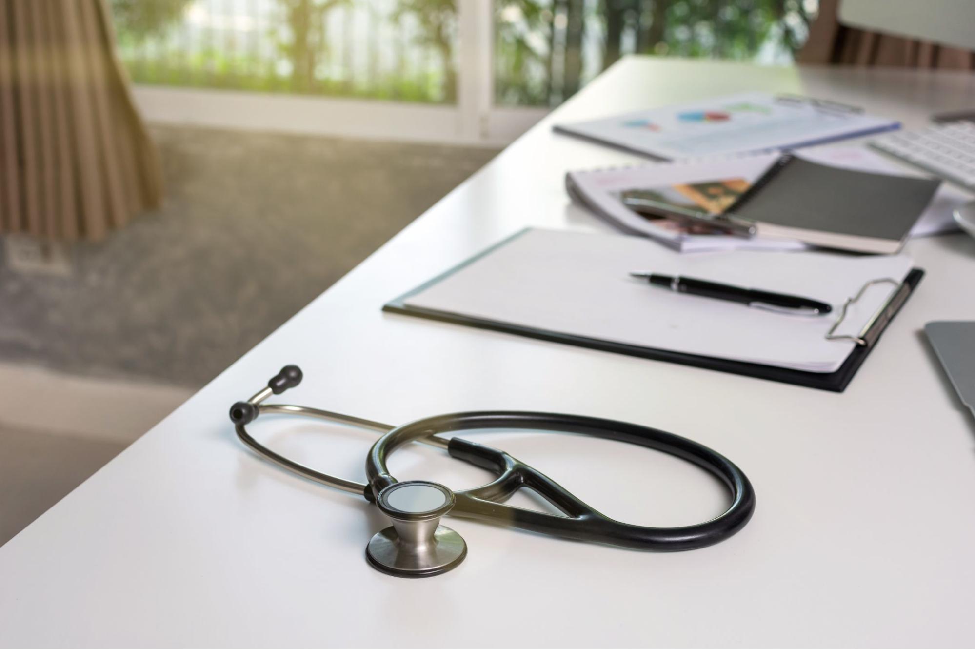 Stethoscope and medical clipboard representing physician-supervised ketamine therapy and patient evaluation. 