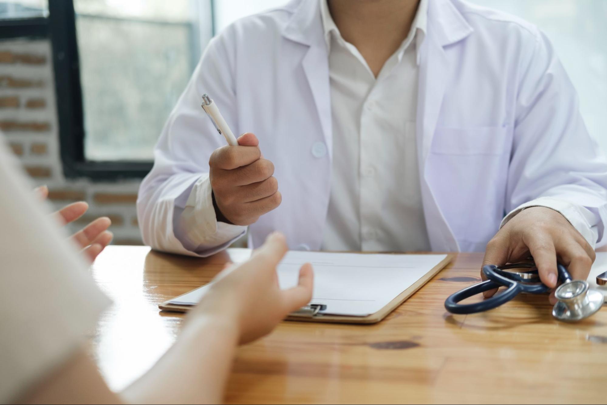 Patient discussing treatment goals and next steps with a healthcare professional during a consultation.